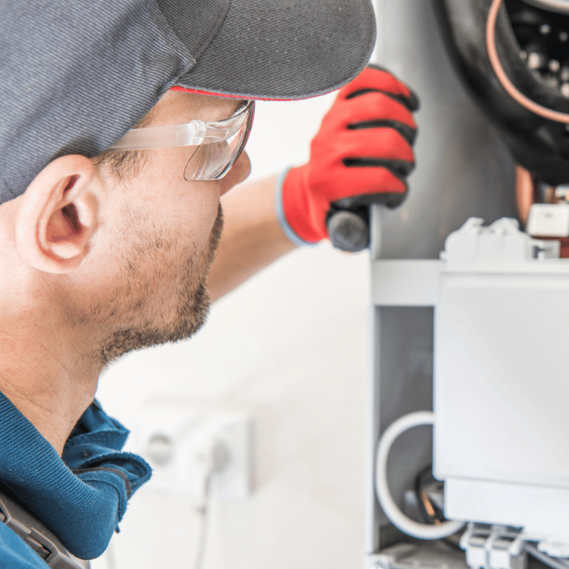 Service technician inspecting equipment, from Tesco’s existing website